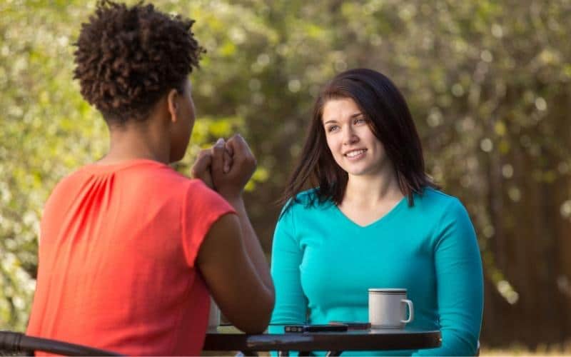 picture of woman talking and giving advice to each other