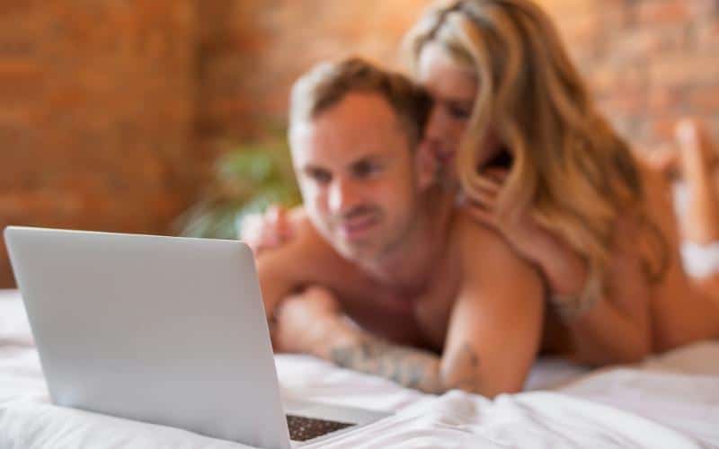 picture of a husband and wife watching porn together