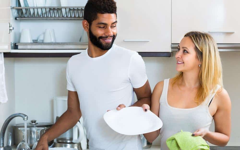 picture of a husband helping around house with wife