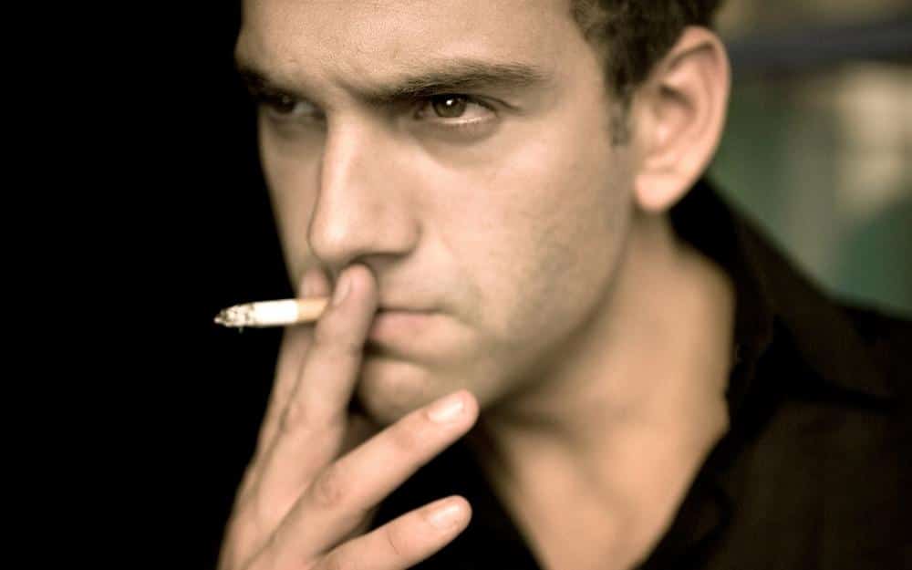 picture of a married man smoking a cigarette and having erectile dysfunction problems