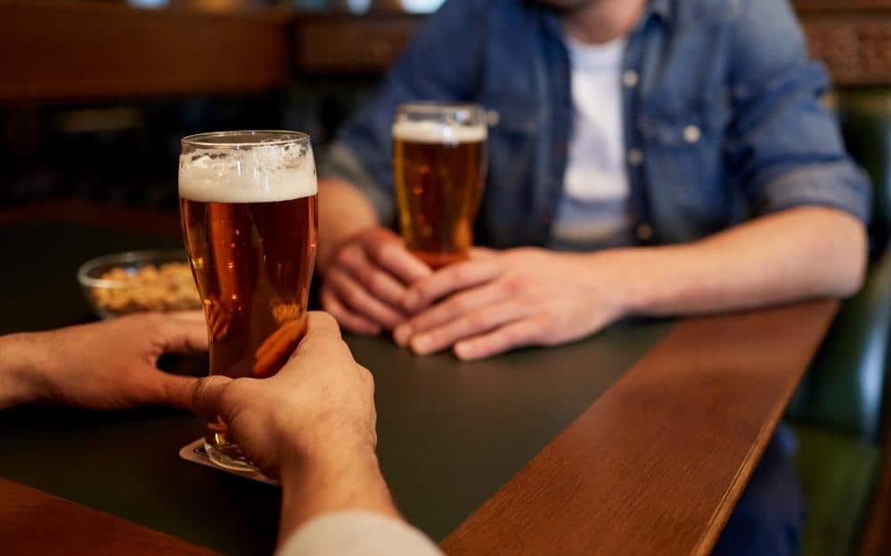 picture of men having beers and discussing wife's infidelity